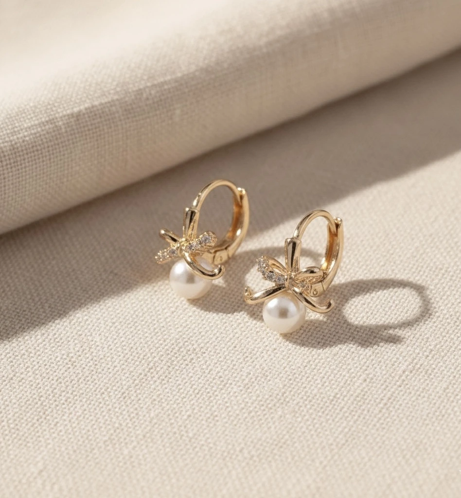 Pearl Bow Huggie Earrings